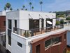 Modern home with House Building Type, Stucco Siding Material, Metal Siding Material, Large Patio, Porch, Deck, Wood Patio, Porch, Deck, Concrete Patio, Porch, Deck, Metal Fences, Wall, Rooftop, Doors, Exterior, and Sliding Door Type. Palm trees and hillsides are among the views from large outdoor decks. Photo 2 of COVO