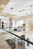 Modern home with Hallway and Light Hardwood Floor. Glass railings keep the home feeling open and allow light to flow unencumbered through the space. Photo 7 of BUILDER Chōwa Concept Home