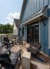 The owner’s suite features a large 21’ x 9’-8” terrace with extensive glazing and large french doors, creating an indoor/outdoor ambiance. Photo 10 of Retreat at McLean and Mehr Farm modern home