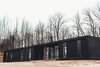 Modern home with Exterior, Prefab Building Type, Metal Siding Material, and Flat RoofLine. Exterior shot of home. Photo of The Caudill House