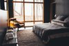 Modern home with Bedroom, Bed, Shelves, Night Stands, Chair, Ceiling Lighting, Recessed Lighting, and Concrete Floor. Master bedroom with floor to ceiling windows. Photo 7 of The Caudill House