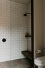 Modern home with Bath Room, Concrete Floor, Open Shower, Subway Tile Wall, Undermount Sink, and Pendant Lighting. Shower with shower glass and bench in guest bathroom. Photo 16 of North Shore #7