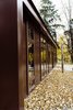 The exterior is finished in a black red metal. Photo 19 of North Shore #7 modern home