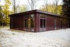 Floor-to-ceiling windows line the walls of the structure. Photo 20 of North Shore #7 modern home