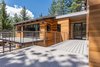 Modern home with Exterior, House Building Type, Metal Roof Material, and Wood Siding Material. Open, glass front entry and the large, inviting deck Photo 2 of Mammoth Modern House 1