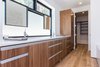 Modern home with Bath Room, Quartzite Counter, Medium Hardwood Floor, Undermount Sink, Drop In Tub, Full Shower, Enclosed Shower, Ceiling Lighting, One Piece Toilet, Whirlpool Tub, and Porcelain Tile Wall. Master bath with dual sink vanities and custom closet Photo 5 of Mammoth Modern House 1