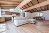 Modern home with Living Room, Sofa, Sectional, Ceiling Lighting, Medium Hardwood Floor, and Gas Burning Fireplace. An open floor plan with lounge, kitchen and dining Photo 10 of Mammoth Modern House 1