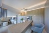 Modern home with Office, Study Room Type, Chair, Bookcase, Storage, Shelves, Desk, Light Hardwood Floor, Rug Floor, Cement Tile Floor, Limestone Floor, and Ceramic Tile Floor. www.adj.com.hk @studioadjective Photo 8 of Dragon's Range Studio Adjective HONG KONG
