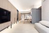 The custom-made cabinet wall with white washed oak panels and charcoal grey metal detail, resting in front of a striped backdrop. #studioadjective @studioadjective #apartment #home Photo 14 of Larvotto Studio Adjective HONG KONG modern home