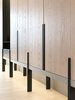 The custom-made cabinet wall with white washed oak panels and charcoal grey metal detail, resting in front of a striped backdrop. #studioadjective @studioadjective #apartment #home Photo 19 of Larvotto Studio Adjective HONG KONG modern home