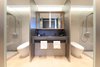 Modern home with Bath Room, Ceiling Lighting, Stone Tile Wall, Ceramic Tile Floor, Stone Counter, Two Piece Toilet, Light Hardwood Floor, Freestanding Tub, Drop In Sink, Ceramic Tile Wall, and Open Shower. The Bathrooms
Two identical bathrooms for the two clients.
www.adj.com.hk
Instagram : @Studioadjective Photo 5 of Larvotto Studio Adjective HONG KONG