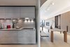 Modern home with Kitchen, Ceiling Lighting, Glass Tile Backsplashe, Wood Cabinet, Track Lighting, Light Hardwood Floor, Concrete Counter, Tile Counter, Ceramic Tile Floor, Wall Lighting, and Pendant Lighting. The Kitchen & Dining Room
The custom-made cabinet wall with white washed oak panels and charcoal grey metal detail, resting in front of a striped backdrop. #studioadjective @studioadjective #apartment #home #Kitchen #residential
Studio Adjective Ltd.
www.adj.com.hk
Instagram : @Studioadjective Photo 9 of Larvotto Studio Adjective HONG KONG