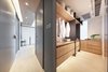 Modern home with Storage Room, Cabinet Storage Type, Shelves Storage Type, and Closet Storage Type. The Walk-in Closet
The custom-made cabinet wall with white washed oak panels and charcoal grey metal detail, resting in front of a striped backdrop. #studioadjective @studioadjective #apartment #home
Studio Adjective Ltd.
www.adj.com.hk
Instagram : @Studioadjective Photo 7 of Larvotto Studio Adjective HONG KONG