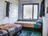 Modern home with Bedroom, Bed, Bookcase, Storage, Shelves, Night Stands, and Wardrobe. This rug was handpicked by Matt in India and really opens up an inviting room in Houze II Photo 7 of Flophouze Hotel