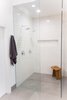 Modern home with Bath Room, Engineered Quartz Counter, Quartzite Counter, Porcelain Tile Floor, Wall Mount Sink, Freestanding Tub, Open Shower, Ceiling Lighting, Accent Lighting, Pendant Lighting, Porcelain Tile Wall, and One Piece Toilet. Sea Star Master Bathroom - After Photo 3 of Sea Star Master Bathroom - Hidden Potential