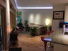 Modern home with Living Room, Recliner, Sectional, Coffee Tables, Chair, Ottomans, End Tables, Ceiling Lighting, Floor Lighting, Recessed Lighting, Accent Lighting, and Light Hardwood Floor. Family room Photo 3 of The Joseph House