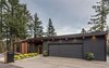Modern home with Exterior, Brick Siding Material, House Building Type, Butterfly RoofLine, and Wood Siding Material. Facade Photo of The Greenhills House