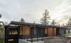 Modern home with Exterior, Butterfly RoofLine, House Building Type, Wood Siding Material, and Brick Siding Material. Facade Photo 2 of The Greenhills House