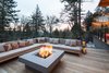 Modern home with Outdoor, Hardscapes, Horizontal Fences, Wall, Wood Patio, Porch, Deck, Raised Planters, Large Patio, Porch, Deck, Trees, Decking Patio, Porch, Deck, Metal Fences, Wall, Hanging Lighting, Wood Fences, Wall, Back Yard, Landscape Lighting, and Wire Fences, Wall. Fire pit terrace Photo 5 of The Greenhills House