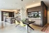 Modern home with Dining Room, Ceiling Lighting, Storage, Shelves, Table, Concrete Floor, Stools, Recessed Lighting, Accent Lighting, Pendant Lighting, Bar, and Chair. Dining and kitchen Photo 10 of The Greenhills House