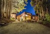 Modern home with Undermount Sink, Wood Burning Fireplace, Front Yard, Gardens, Outdoor, and Trees. New Entry garden with hot tub and pétanque court. Photo of The House of the Falling Moon