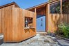 Modern home with Exterior, House, and Wood Siding Material. Entry Area post remodel Photo 4 of The House of the Falling Moon