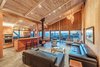 Modern home with Living Room, Ceiling Lighting, Sofa, Pendant Lighting, Porcelain Tile Floor, and Wood Burning Fireplace. New beam and column removed existing wall creating a new open plan. Photo 6 of The House of the Falling Moon