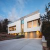 Modern home with Exterior, House Building Type, Wood Siding Material, and Flat RoofLine. Exterior Perspective Photo of Webster Terrace