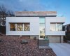 Modern home with Exterior, House Building Type, Flat RoofLine, and Wood Siding Material. Exterior Perspective Photo 2 of Webster Terrace