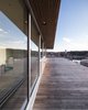 Modern home with Exterior, House Building Type, Wood Siding Material, and Flat RoofLine. Rooftop Patio Photo 5 of Webster Terrace