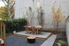 Modern home with Outdoor, Back Yard, Trees, Hardscapes, Gardens, Small Patio, Porch, Deck, Wood Patio, Porch, Deck, Walkways, and Wood Fences, Wall. Garden Photo 6 of Stuyvesant Townhouse