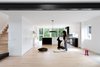 Modern home with Living Room. POST Architecture Inc. used dark accents to create depth amidst the white walls and light hardwood floors. Photo 6 of Peak-a-Boo House