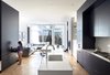 Modern home with Kitchen and Light Hardwood Floor. Living Room & Kitchen Photo 3 of (re) Edwardian House by Post Architecture Inc.
