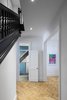 Modern home with Hallway and Light Hardwood Floor. Wallpaper in the Powder Room Photo 8 of (re) Edwardian House by Post Architecture Inc.
