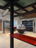Modern home with Living Room and Light Hardwood Floor. Living, detail fo the little bar under the cantilevered mezzanine Photo 6 of CAFElab architects turns an old farmhouse into a luxury residence in Rome