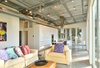 Modern home with Living Room, Sofa, Ceiling Lighting, Coffee Tables, Chair, End Tables, and Concrete Floor. Living room Photo 5 of The Beatty Home