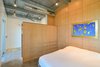 Modern home with Bedroom, Storage, Night Stands, Wardrobe, Dresser, Ceiling Lighting, Bed, Shelves, and Concrete Floor. Master bedroom Photo 7 of The Beatty Home