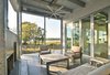 Modern home with Outdoor, Concrete Patio, Porch, Deck, Wire Fences, Wall, Stone Patio, Porch, Deck, Large Patio, Porch, Deck, Grass, Decking Patio, Porch, Deck, Side Yard, Hanging Lighting, Horizontal Fences, Wall, Trees, and Wood Patio, Porch, Deck. Outdoor patio Photo 10 of The Beatty Home
