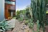 Modern home with Outdoor, Gardens, Front Yard, Concrete Patio, Porch, Deck, and Landscape Lighting. Entry with cactus garden Photo 4 of The Rempel Temple