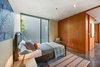 Modern home with Bedroom, Concrete Floor, and Ceiling Lighting. Level 1 teen bedroom Photo 9 of The Rempel Temple