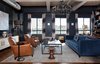 Modern home with Living Room, Sofa, Chair, End Tables, Coffee Tables, Ceiling Lighting, Table Lighting, Pendant Lighting, Medium Hardwood Floor, Media Cabinet, and Stools. Marcel Club chairs: Restoration Hardware
Eames Walnut stool: Shape B
Photo 7 of Eastern Columbia Loft