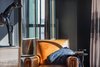 Modern home with Living Room, Chair, Console Tables, and Media Cabinet. Vintage leather horse - Empiric, LA Photo 11 of Eastern Columbia Loft