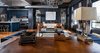 Modern home with Living Room, Bench, Chair, Sofa, Media Cabinet, Desk, Lamps, Stools, and Medium Hardwood Floor. KITCHEN - LlVING ROOM Photo 18 of Eastern Columbia Loft