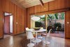 Modern home with Kitchen, Tile Counter, Wood Cabinet, Vinyl Floor, Wall Lighting, Ceiling Lighting, Refrigerator, Wall Oven, Cooktops, and Range Hood. Eat-in portion of the kitchen Photo 4 of Vintage Hollywood in the Berkeley Hills