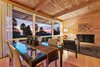 Modern home with Dining Room, Wall Lighting, and Light Hardwood Floor. Open dining and living room with vaulted wood planked-wood ceilings Photo 5 of Vintage Hollywood in the Berkeley Hills