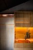 Modern home with Kitchen, Metal Counter, Painted Wood Floor, Ceiling Lighting, Wood Cabinet, Recessed Lighting, Wall Lighting, Range Hood, and Vessel Sink. Japanese oak kitchen cabinetry is combined with a unique copper worktop and services ducting. Photo 8 of Ichijoji House