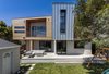 Modern home with Exterior, House Building Type, Wood Siding Material, Stucco Siding Material, and Metal Siding Material. back of house Photo 3 of Legal House