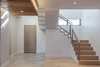Modern home with Staircase, Wood Tread, Metal Railing, and Wood Railing. entry and stair Photo 4 of Legal House