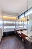 Modern home with Bath Room, Ceramic Tile Floor, Engineered Quartz Counter, Undermount Sink, Drop In Tub, Enclosed Shower, Accent Lighting, and Wall Lighting. master bath Photo 9 of Legal House