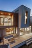 Modern home with Exterior, House Building Type, Stucco Siding Material, Wood Siding Material, and Metal Siding Material. back patio Photo 11 of Legal House